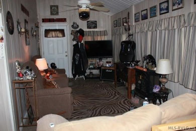 Check out this fully furnished 1994 camper with addition built on River Ridge Golf Club in Virginia - for sale on GolfHomes.com, golf home, golf lot