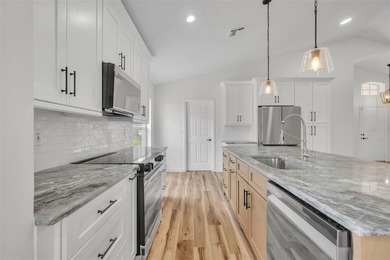 Welcome to this beautifully updated home in the sought-after on Kings Ridge Golf Club in Florida - for sale on GolfHomes.com, golf home, golf lot