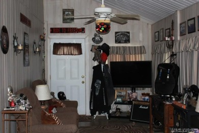 Check out this fully furnished 1994 camper with addition built on River Ridge Golf Club in Virginia - for sale on GolfHomes.com, golf home, golf lot