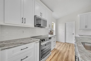 Welcome to this beautifully updated home in the sought-after on Kings Ridge Golf Club in Florida - for sale on GolfHomes.com, golf home, golf lot