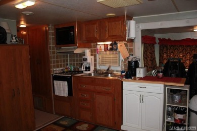 Check out this fully furnished 1994 camper with addition built on River Ridge Golf Club in Virginia - for sale on GolfHomes.com, golf home, golf lot