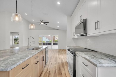 Welcome to this beautifully updated home in the sought-after on Kings Ridge Golf Club in Florida - for sale on GolfHomes.com, golf home, golf lot