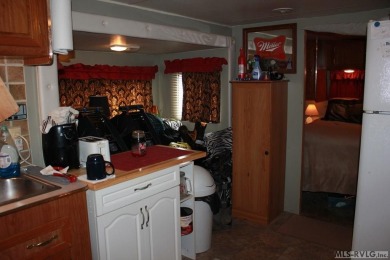 Check out this fully furnished 1994 camper with addition built on River Ridge Golf Club in Virginia - for sale on GolfHomes.com, golf home, golf lot