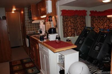 Check out this fully furnished 1994 camper with addition built on River Ridge Golf Club in Virginia - for sale on GolfHomes.com, golf home, golf lot