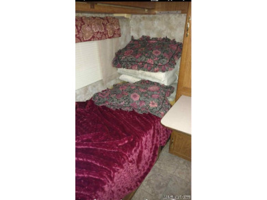 Check out this fully furnished 1994 camper with addition built on River Ridge Golf Club in Virginia - for sale on GolfHomes.com, golf home, golf lot