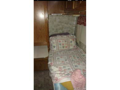 Check out this fully furnished 1994 camper with addition built on River Ridge Golf Club in Virginia - for sale on GolfHomes.com, golf home, golf lot