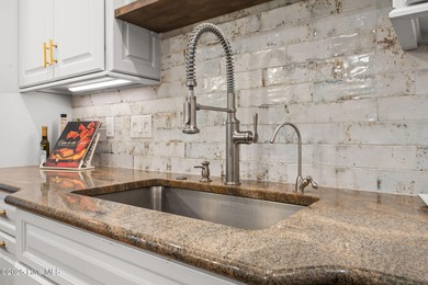 This exceptional home blends timeless Southern charm with on Lockwood Folly Country Club in North Carolina - for sale on GolfHomes.com, golf home, golf lot