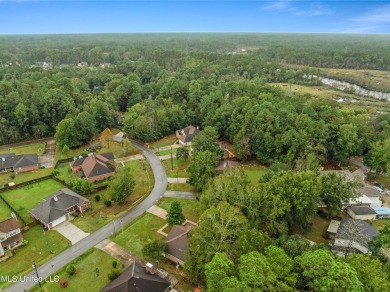 This charming 3-bedroom, 2-bathroom home is a perfect starter on Mississippi National Golf Course in Mississippi - for sale on GolfHomes.com, golf home, golf lot