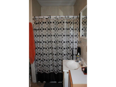 Check out this fully furnished 1994 camper with addition built on River Ridge Golf Club in Virginia - for sale on GolfHomes.com, golf home, golf lot