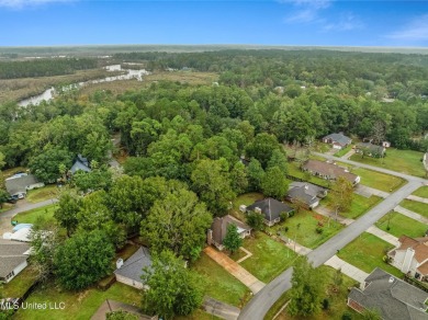 This charming 3-bedroom, 2-bathroom home is a perfect starter on Mississippi National Golf Course in Mississippi - for sale on GolfHomes.com, golf home, golf lot