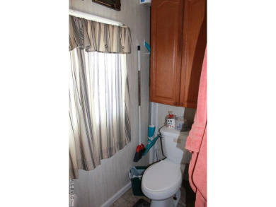Check out this fully furnished 1994 camper with addition built on River Ridge Golf Club in Virginia - for sale on GolfHomes.com, golf home, golf lot