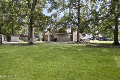 This charming 3-bedroom, 2-bathroom home is a perfect starter on Mississippi National Golf Course in Mississippi - for sale on GolfHomes.com, golf home, golf lot