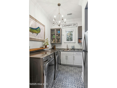 This exceptional home blends timeless Southern charm with on Lockwood Folly Country Club in North Carolina - for sale on GolfHomes.com, golf home, golf lot