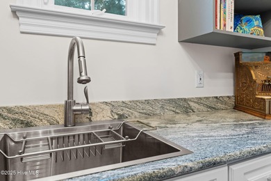 This exceptional home blends timeless Southern charm with on Lockwood Folly Country Club in North Carolina - for sale on GolfHomes.com, golf home, golf lot