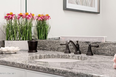 This exceptional home blends timeless Southern charm with on Lockwood Folly Country Club in North Carolina - for sale on GolfHomes.com, golf home, golf lot