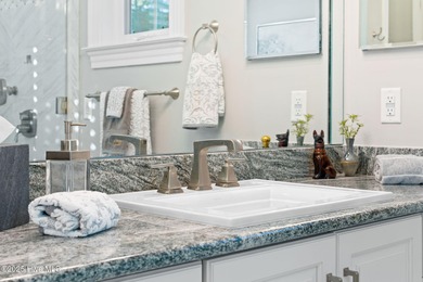 This exceptional home blends timeless Southern charm with on Lockwood Folly Country Club in North Carolina - for sale on GolfHomes.com, golf home, golf lot