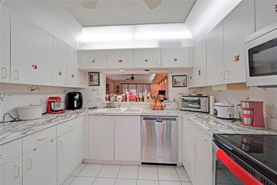 RARELY AVAILABLE PORTOFINO MODEL - 1ST FLOOR UNIT IN COVETED on Sunrise Lakes Phase III in Florida - for sale on GolfHomes.com, golf home, golf lot