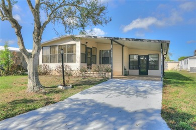 Just a short walk to the golf course, this well-maintained home on Barefoot Bay Golf Course in Florida - for sale on GolfHomes.com, golf home, golf lot