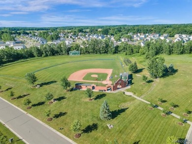 Must see this massive 2.28 acre vacant lot with 132 ft of on Spring Meadows Country Club in Michigan - for sale on GolfHomes.com, golf home, golf lot