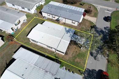 Just a short walk to the golf course, this well-maintained home on Barefoot Bay Golf Course in Florida - for sale on GolfHomes.com, golf home, golf lot