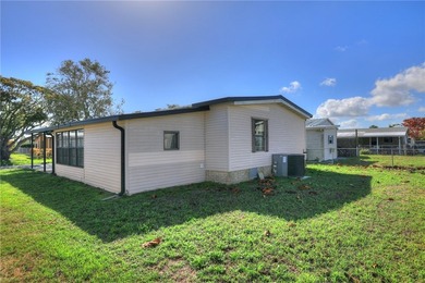 Just a short walk to the golf course, this well-maintained home on Barefoot Bay Golf Course in Florida - for sale on GolfHomes.com, golf home, golf lot