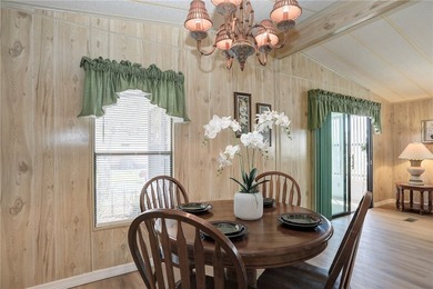 Just a short walk to the golf course, this well-maintained home on Barefoot Bay Golf Course in Florida - for sale on GolfHomes.com, golf home, golf lot