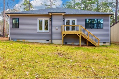 This single-family home offers three bedrooms, two bathrooms on Carolina Trace Country Club in North Carolina - for sale on GolfHomes.com, golf home, golf lot