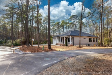 This single-family home offers three bedrooms, two bathrooms on Carolina Trace Country Club in North Carolina - for sale on GolfHomes.com, golf home, golf lot