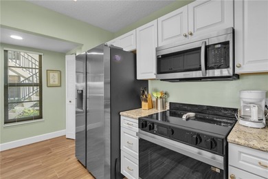 Beautifully updated FIRST-FLOOR furnished turnkey gem-a on Vista Plantation Golf Club in Florida - for sale on GolfHomes.com, golf home, golf lot