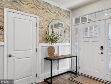 Welcome to 24262 Canoe Drive, an exquisite townhome villa on The Peninsula Golf and Country Club in Delaware - for sale on GolfHomes.com, golf home, golf lot