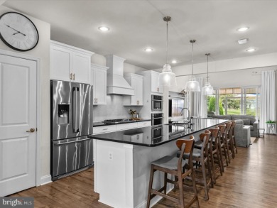 Welcome to 24262 Canoe Drive, an exquisite townhome villa on The Peninsula Golf and Country Club in Delaware - for sale on GolfHomes.com, golf home, golf lot