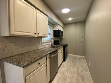 Charming and move-in ready block single family home featuring 2 on Zephyrhills Municipal Golf Course in Florida - for sale on GolfHomes.com, golf home, golf lot