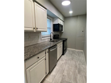 Charming and move-in ready block single family home featuring 2 on Zephyrhills Municipal Golf Course in Florida - for sale on GolfHomes.com, golf home, golf lot