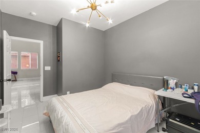 This beautifully renovated two-story home offers five bedrooms on Rhodes Ranch Golf Club in Nevada - for sale on GolfHomes.com, golf home, golf lot