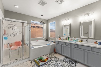 This beautifully renovated two-story home offers five bedrooms on Rhodes Ranch Golf Club in Nevada - for sale on GolfHomes.com, golf home, golf lot