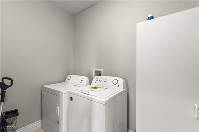 This beautifully renovated two-story home offers five bedrooms on Rhodes Ranch Golf Club in Nevada - for sale on GolfHomes.com, golf home, golf lot