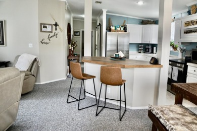 RELAX in this impeccably maintained 2003 Palm Harbor 2 bed/2 on The Club At Pointe West in Florida - for sale on GolfHomes.com, golf home, golf lot