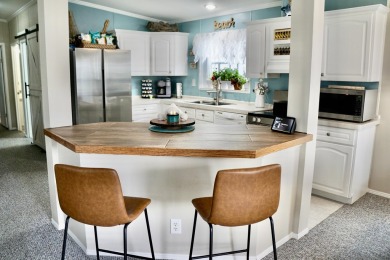 RELAX in this impeccably maintained 2003 Palm Harbor 2 bed/2 on The Club At Pointe West in Florida - for sale on GolfHomes.com, golf home, golf lot