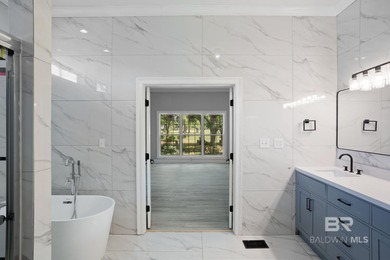 Welcome to 621 Wedgewood Drive! A stunningly renovated residence on The Golf Club of the Wharf in Alabama - for sale on GolfHomes.com, golf home, golf lot