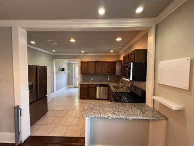 This beautifully maintained home sits on a generously sized lot on Stevens Park Golf Course in Texas - for sale on GolfHomes.com, golf home, golf lot