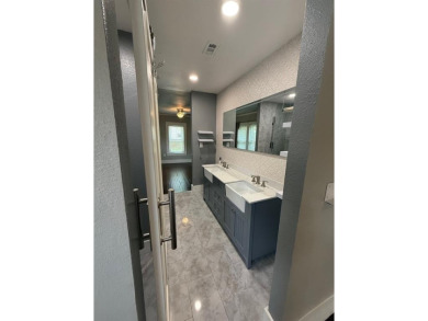 This beautifully maintained home sits on a generously sized lot on Stevens Park Golf Course in Texas - for sale on GolfHomes.com, golf home, golf lot