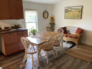 This beautifully maintained and recently updated home has 400 ft on Elk Rapids Golf Club in Michigan - for sale on GolfHomes.com, golf home, golf lot