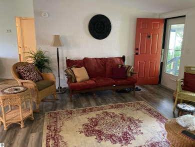 This beautifully maintained and recently updated home has 400 ft on Elk Rapids Golf Club in Michigan - for sale on GolfHomes.com, golf home, golf lot