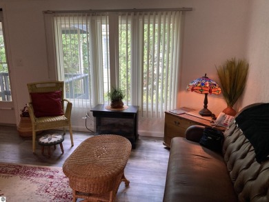This beautifully maintained and recently updated home has 400 ft on Elk Rapids Golf Club in Michigan - for sale on GolfHomes.com, golf home, golf lot
