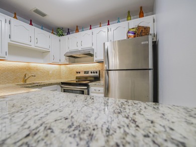 Impeccable first floor 1BR with washer and dryer in the on Vero Beach South Golf Course in Florida - for sale on GolfHomes.com, golf home, golf lot