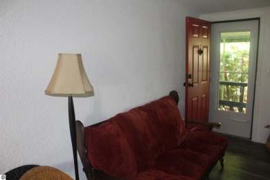 This beautifully maintained and recently updated home has 400 ft on Elk Rapids Golf Club in Michigan - for sale on GolfHomes.com, golf home, golf lot