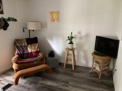This beautifully maintained and recently updated home has 400 ft on Elk Rapids Golf Club in Michigan - for sale on GolfHomes.com, golf home, golf lot