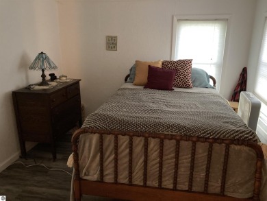 This beautifully maintained and recently updated home has 400 ft on Elk Rapids Golf Club in Michigan - for sale on GolfHomes.com, golf home, golf lot