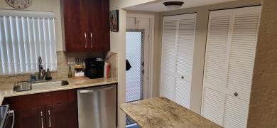 Updated 2 bed 2 bath in Sunrise Lakes Solid Wood Cherry Shaker on Sunrise Lakes Phase III in Florida - for sale on GolfHomes.com, golf home, golf lot