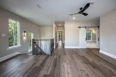 This contemporary home is brimming with amenities, featuring on Chenal Country Club - Bear Den Mountain in Arkansas - for sale on GolfHomes.com, golf home, golf lot